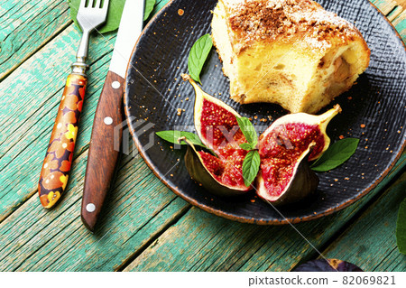 Autumn pie with figs,wooden background Autumn pie with figs,wooden background 82069821