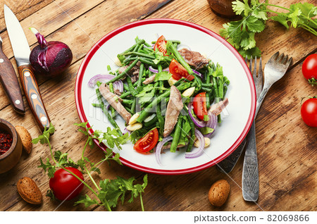 Salad with vegetables and veal tongue Salad with vegetables and veal tongue 82069866