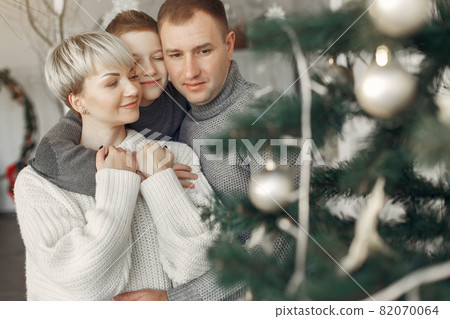 People in a winter clothes in a christmass atmosphere 82070064