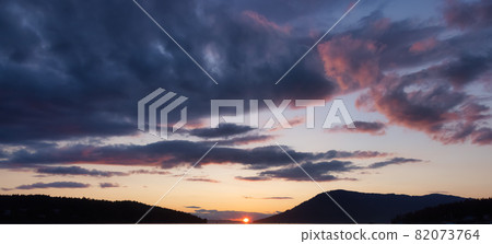 View of colorful cloudscape during dramatic sunset. 82073764