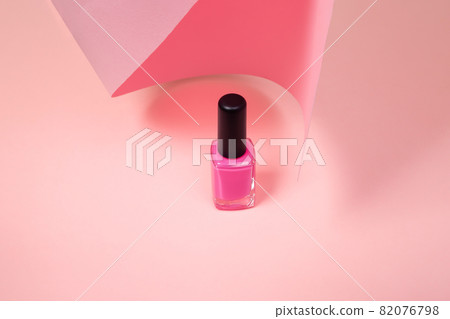 pink nail polish isolated on pink background with copy space. 82076798
