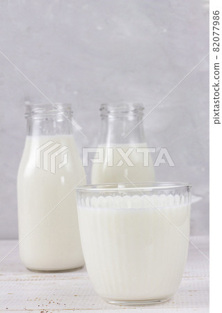 Tasty fresh milk on a white wooden background. a glass of milk. Milk. copy space Tasty fresh milk on a white wooden background. a glass of milk. Milk. copy space 82077986