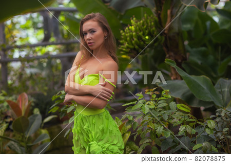 Smiling beauty in garden looking at camera. 82078875
