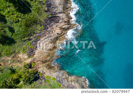 Aerial view Top down seashore wave crashing on seashore Beautiful turquoise sea surface in sunny day Good weather day summer background Amazing seascape top view 82079947