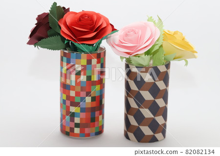 Handmade rose flowers made from origami are displayed in a beautiful vase Handmade rose flowers made from origami are displayed in a beautiful vase 82082134