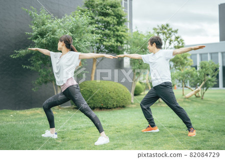 Middle-aged and older men and women doing yoga (hero poses) 82084729