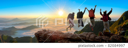 Group of happy hiker jumping on the hill Group of happy hiker jumping on the hill 82084997