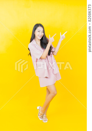 Portrait beautiful young asian woman smile with action 82086373