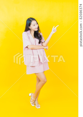 Portrait beautiful young asian woman smile with action 82086374