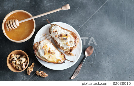 grilled pears baked with ricotta cheese and walnuts. honey topping. dieting sweet dessert,vegetarian food grilled pears baked with ricotta cheese and walnuts. honey topping. dieting sweet dessert,vegetarian food 82088010