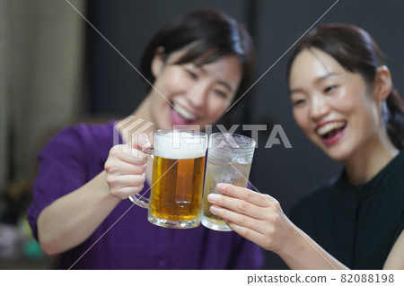 A woman drinking alcohol 82088198