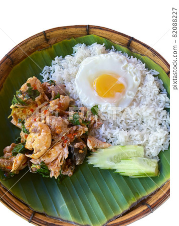 Rice topped with stir-fried pork or beef and basil Rice topped with stir-fried pork or beef and basil 82088227