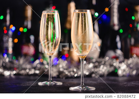 Champagne glasses on a dark background. Champagne glasses on a dark background. 82088472