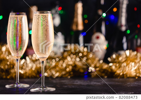 Champagne glasses on a dark background. Champagne glasses on a dark background. 82088473