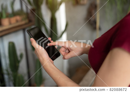 woman using smart phone for mobile payments online shopping channel. 82088672