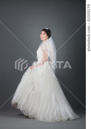portrait of beautiful bride wearing white wedding dress portrait of beautiful bride wearing white wedding dress 82089239