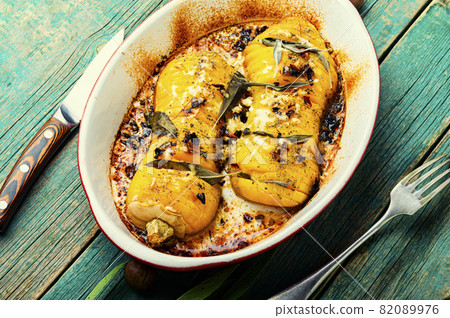 Baked pumpkin with spice herbs 82089976