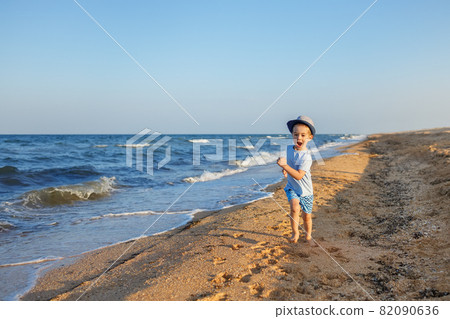 little boy with colorful kite on the beach little boy with colorful kite on the beach 82090636