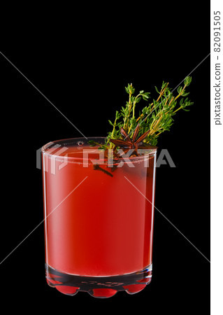 Hot cranberry winter drink with thyme, cloves and anise Hot cranberry winter drink with thyme, cloves and anise 82091505
