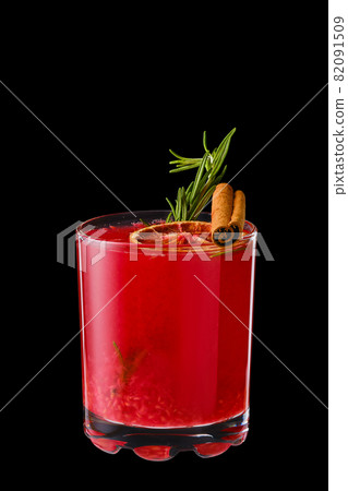 Hot raspberries and orange winter drink with cinnamon and rosemary Hot raspberries and orange winter drink with cinnamon and rosemary 82091509