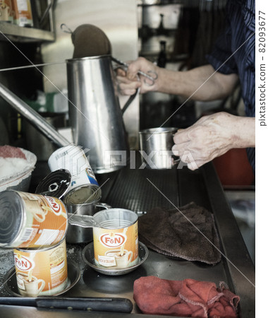 Making Coffee Kopi the Singapore way in a hawker center Making Coffee Kopi the Singapore way in a hawker center 82093677