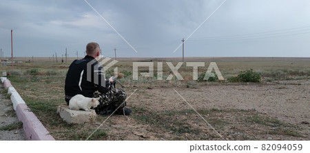 Motorbike driver enjoys nature view Motorbike driver enjoys nature view 82094059