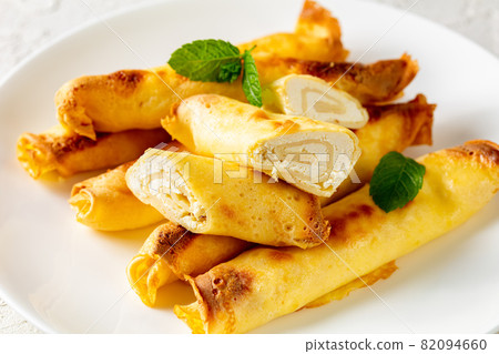 blintz, rolled filled with cottage cheese pancakes blintz, rolled filled with cottage cheese pancakes 82094660