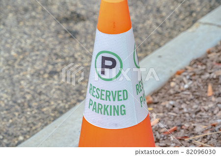 Traffic cone with Reserved Parking sign close up 82096030