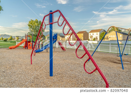 Fun playground for children with colorful slides swings and climbing bars 82097048