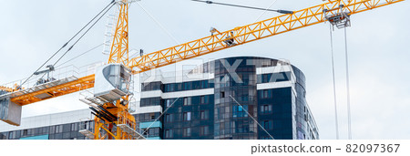 tower crane on the background of the finished building, horizontal frame 82097367