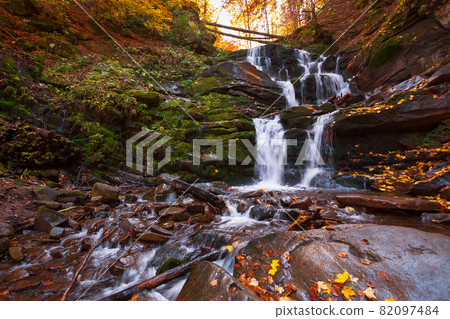 shypot waterfall among the rock in evening light. beautiful autumnal nature scenery in the forest. wet foliage on the stones. popular travel destination of transcarpathia, ukraine 82097484