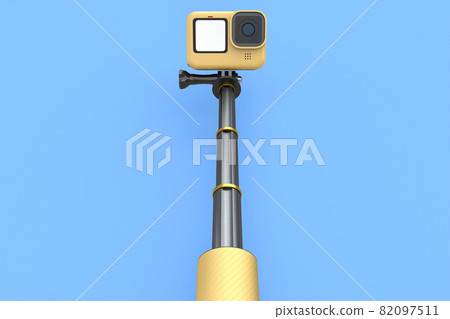 Photo and video lightweight yellow action camera with selfie stick on blue Photo and video lightweight yellow action camera with selfie stick on blue 82097511