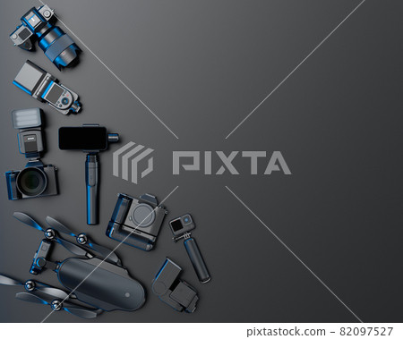 Top view of designer workspace and photography gear on black table background 82097527