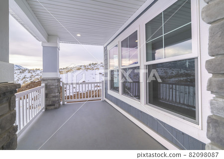 Long covered patio with large glass windows Long covered patio with large glass windows 82098087