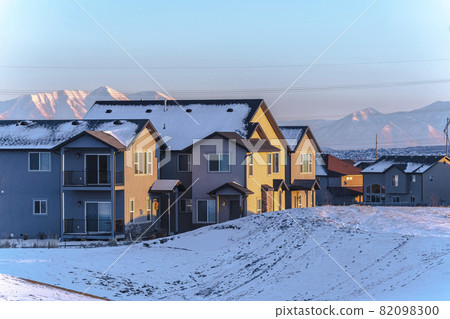 American town street with snow on the ground American town street with snow on the ground 82098300
