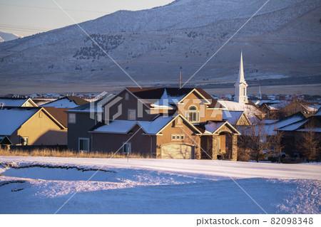 View of American town with a chapel in winter View of American town with a chapel in winter 82098348