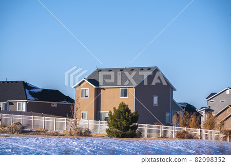 Two story house in American town in winter Two story house in American town in winter 82098352