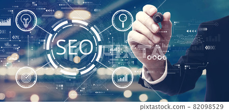 SEO concept with a man on city background SEO concept with a man on city background 82098529
