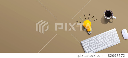 Computer keyboard with a yellow light bulb Computer keyboard with a yellow light bulb 82098572