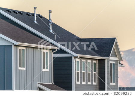 Grey timber house facade at sunset day light Grey timber house facade at sunset day light 82099283