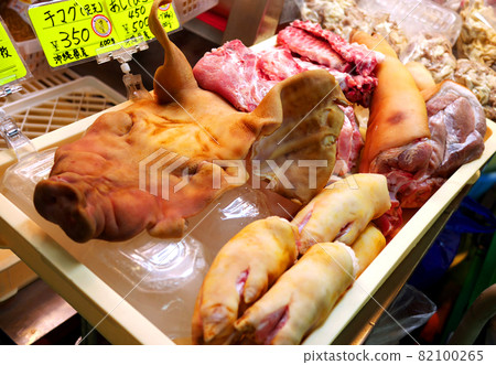 A little surprising but rare food such as pork head (chiller) and pork leg (tebichi) found in the fresh market in Okinawa 82100265
