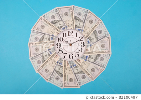 Concept of clock and dollar. Clock on kaleidoscope from money. Concept of clock and dollar. Clock on kaleidoscope from money. 82100497