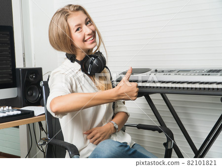 sound engineer woman headphone editor control audio mixing panel studio recording. 82101821