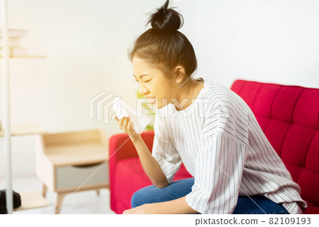 Asian woman with cold blowing and runny nose,Rhinitis sick people,Concept of healthcare,Sneezing women Asian woman with cold blowing and runny nose,Rhinitis sick people,Concept of healthcare,Sneezing women 82109193