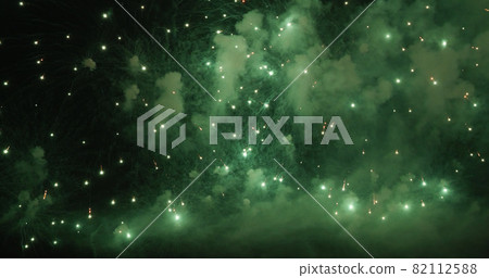 Green Firework celebrate anniversary happy new year 2022, 4th of july holiday festival. Green firework in night time celebrate national holiday. Countdown to new year 2022 festival party time event Green Firework celebrate anniversary happy new year 2022, 4th of july holiday festival. Green firework in night time celebrate national holiday. Countdown to new year 2022 festival party time event 82112588