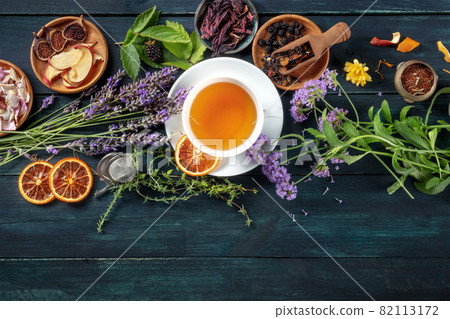 Tea banner with herbs, flowers and fruit, shot from the top Tea banner with herbs, flowers and fruit, shot from the top 82113172