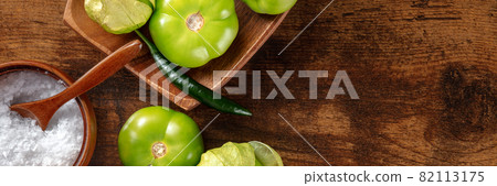 Tomatillos, green tomatoes, panorama with a place for text Tomatillos, green tomatoes, panorama with a place for text 82113175