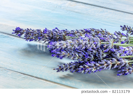 Lavender flower bouquet on a rustic wooden background, lavandula plants 82113179