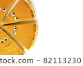 Slices of pumpkin pie in form of Halloween ghost with eyes on white isolated background with copy space. Festive creative food concept 82113230