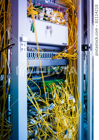 server with connected fiber optic cables server with connected fiber optic cables 82114218